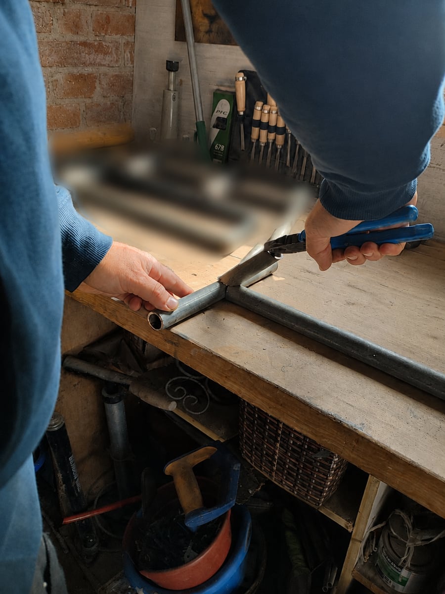 Steel tubing being cut during Tibraise fabrication